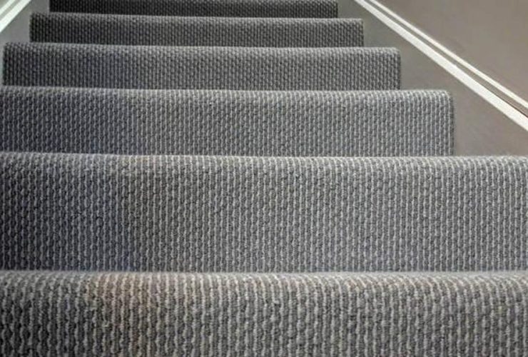 How do staircase carpets compare to tile flooring in terms of comfort and warmth